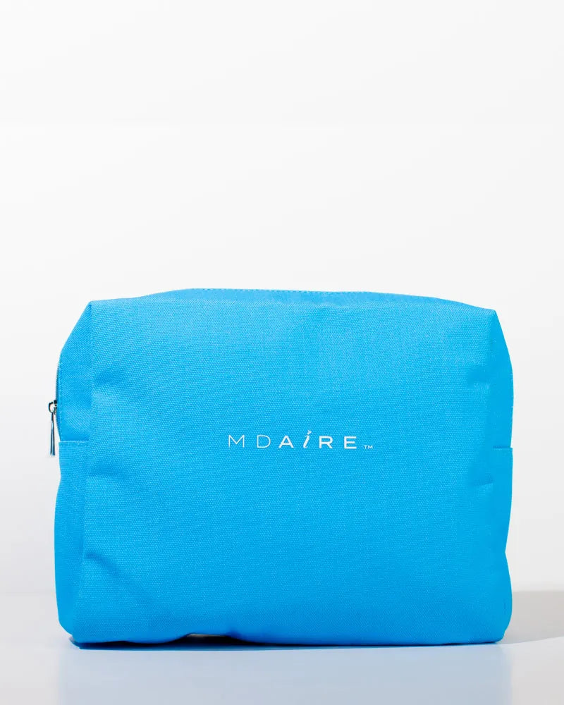 Bright blue MDAiRE cosmetic bag featured in the Glow on the Go Bundle 
