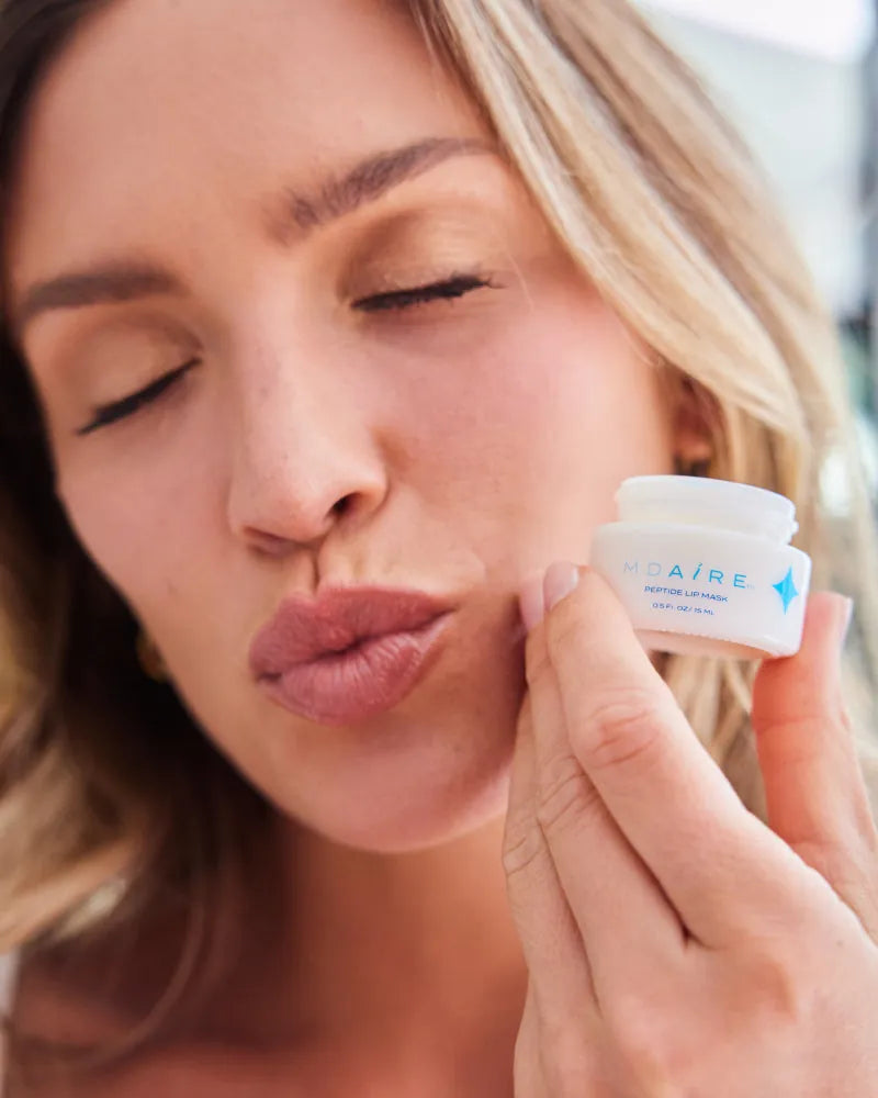 Get Started Bundle showing woman holding MDAiRE Peptide Lip Mask close