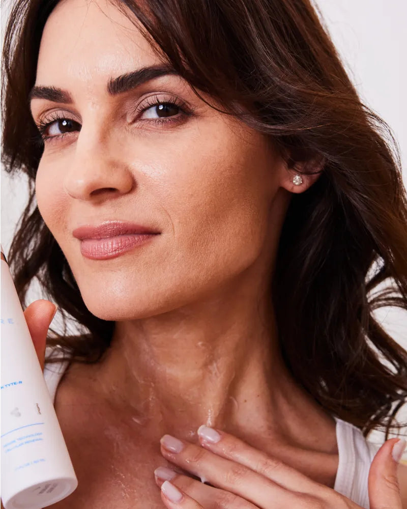 Woman applying Neck Tyte-R moisturizer to neck showing hydration benef