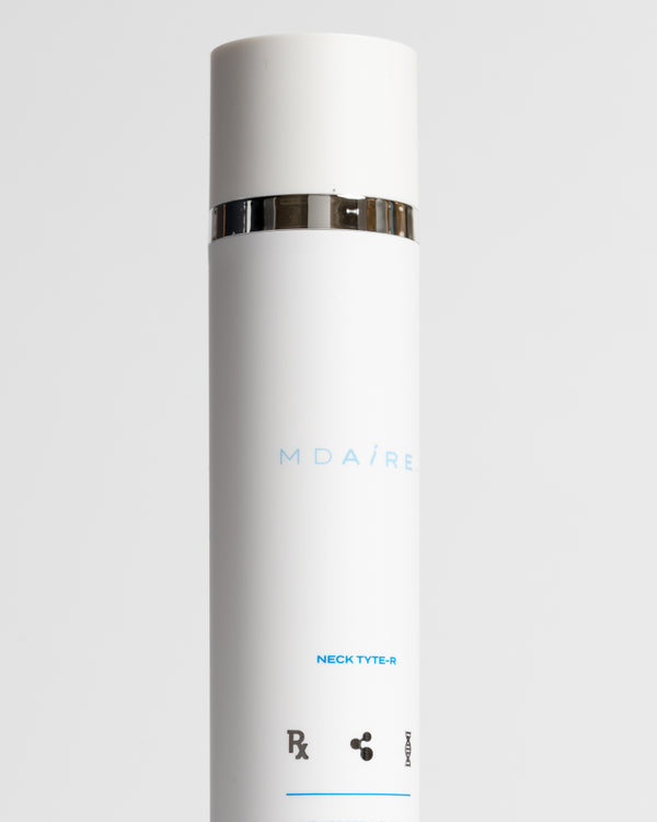 Skincare Essentials Bundle featuring tall white Neck Tyte-R bottle with silver band highlighting advanced formula gallery 1