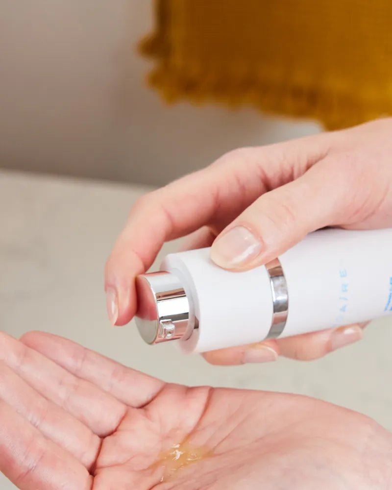 Hand dispensing Vitamin C-FK  Brightening Complex serum in gallery pos